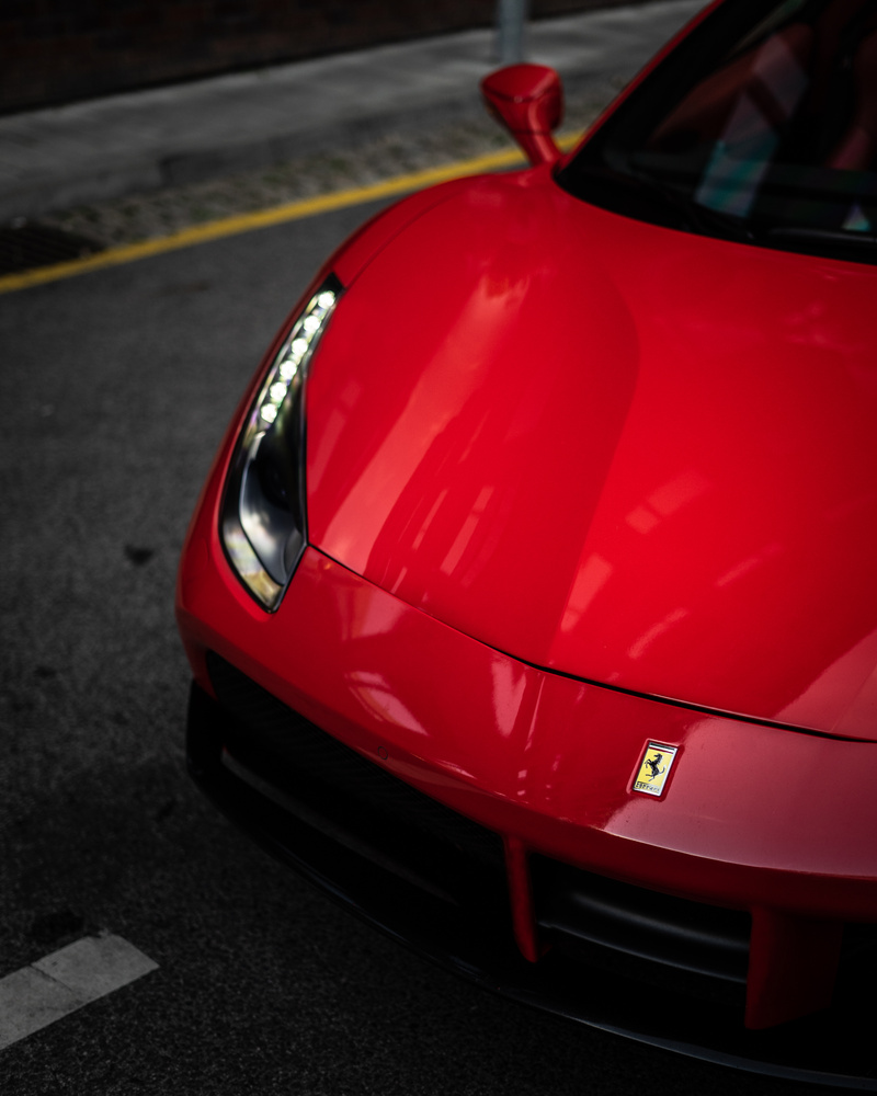 Luxury shiny red sport car with luminous headlights